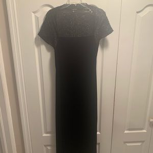 Long black elegant dress .